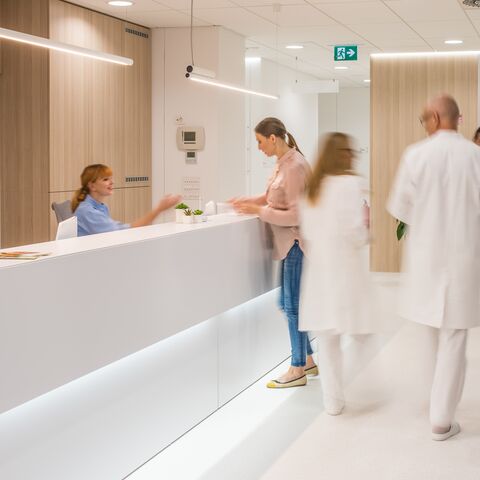 Time-lapse footage of a hospital reception area.