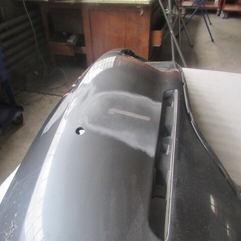 Three photos of a grey car: close-up of the tail light, scratches on the bonnet and rear view of the car with the brown hood.