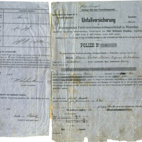 An old, aged accident insurance certificate with handwritten notes and signatures on both sides of the document.